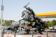 Cowboy Chasing Steer Sculpture